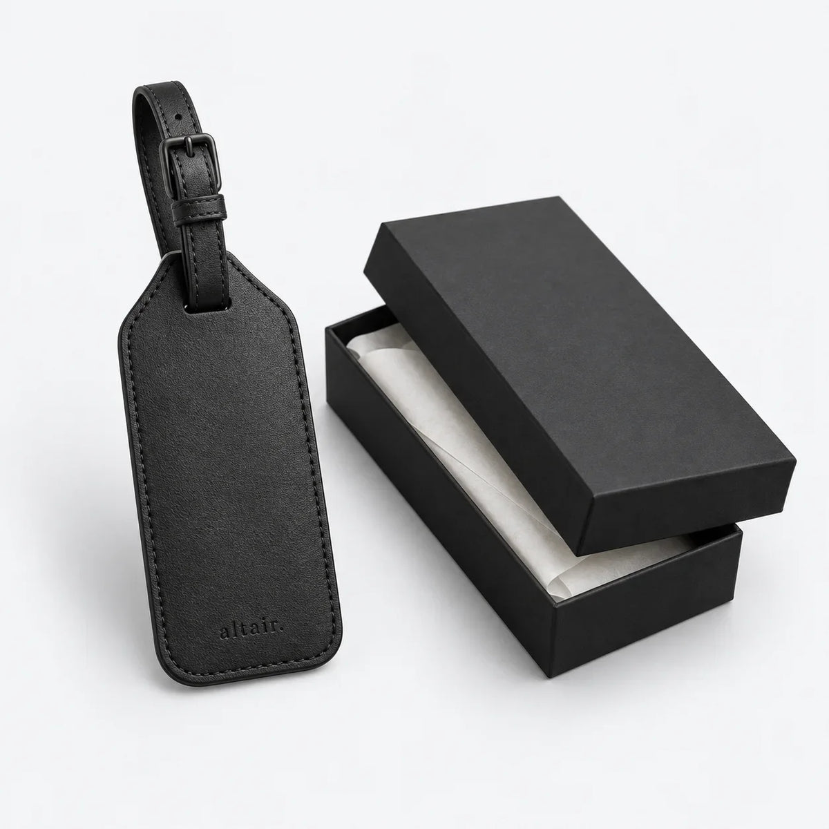 Black ALTAIR grained-leather luggage tag with its gift box